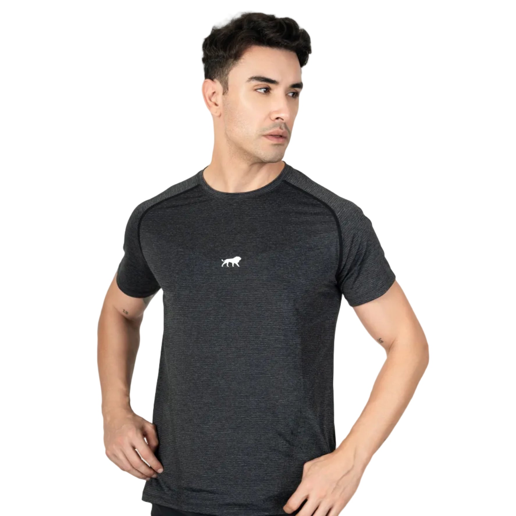 Man wearing a black athletic shirt with a logo on a gray background