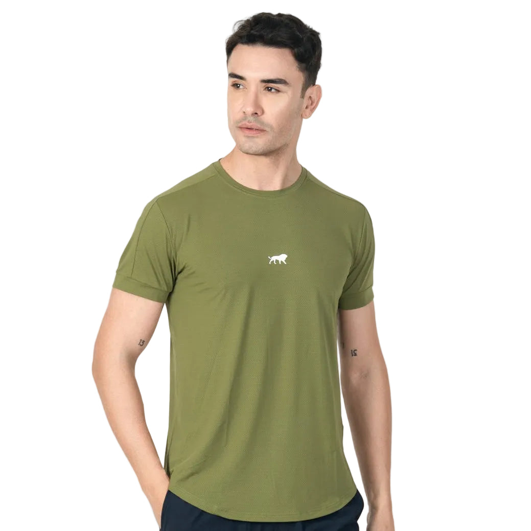 Man wearing a green t-shirt with a small logo on a white background