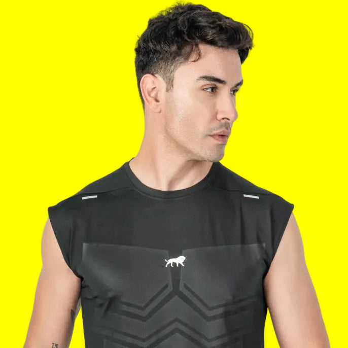 Man wearing a black sleeveless athletic shirt and shorts on a white background